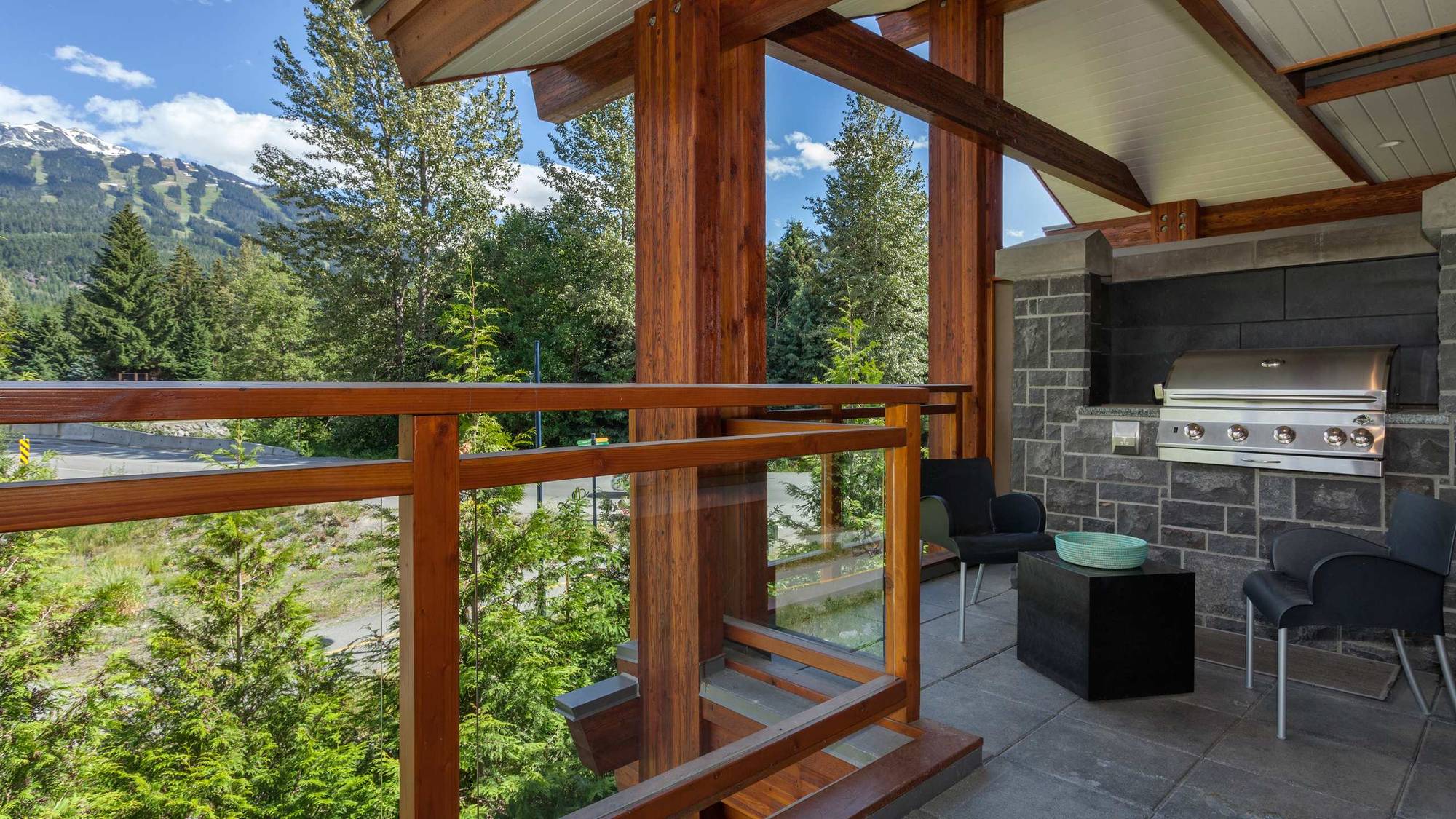 Fitzsimmons Walk in Whistler, deck with a timber railing under a finished soffit, built by Burj Enterprises
