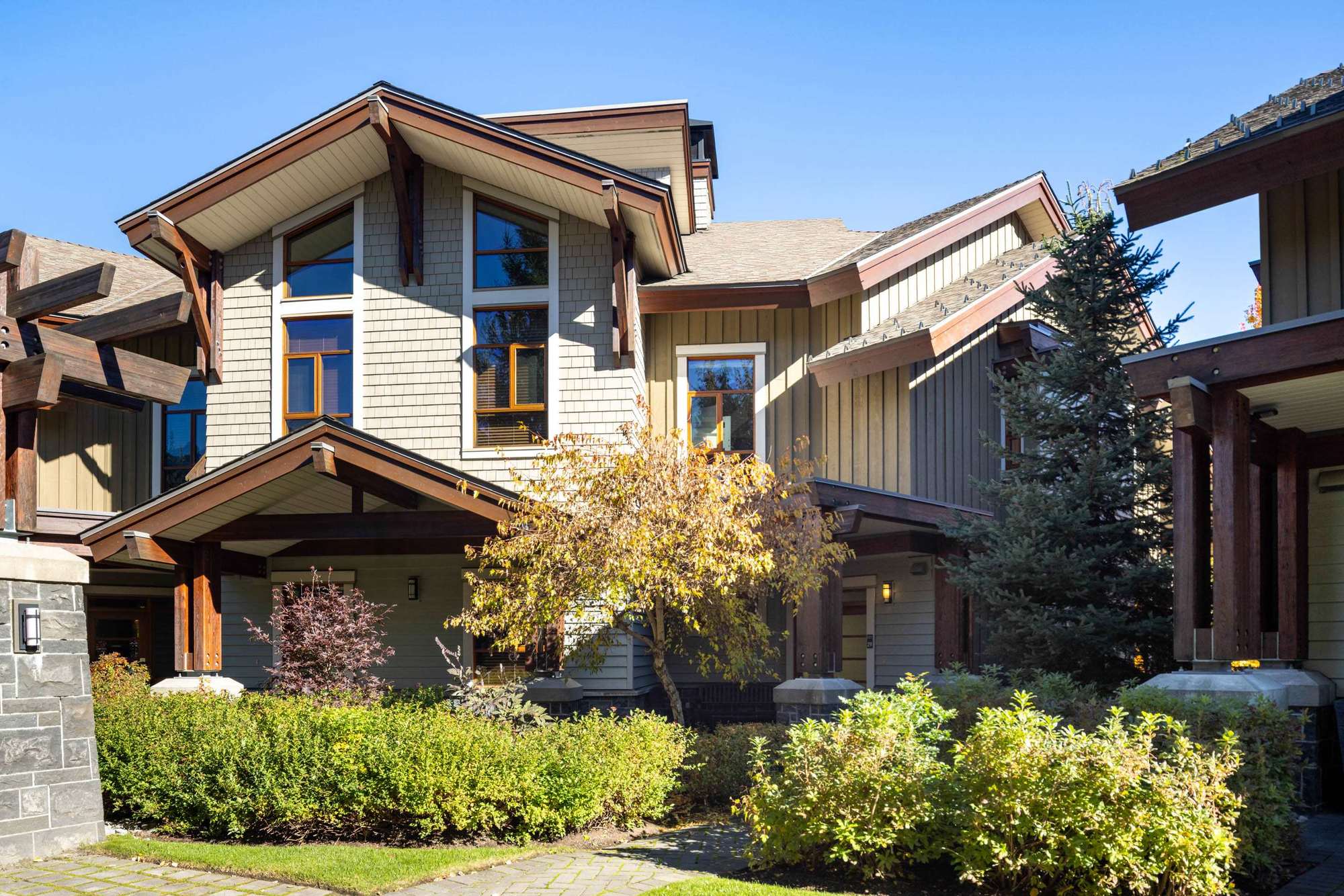 Fitzsimmons Walk in Whistler, siding, gables and entries in autumn, built by Burj Enterprises
