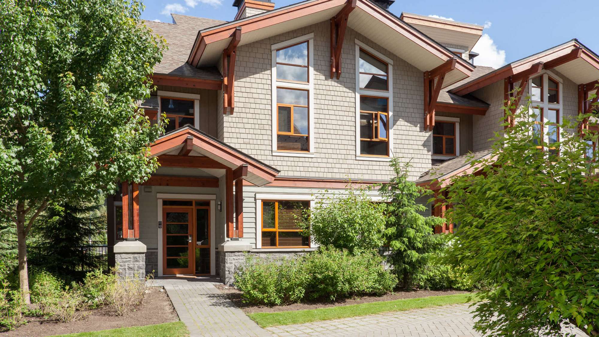 Fitzsimmons Walk in Whistler, shingle cladding and a timber framed entry, built by Burj Enterprises