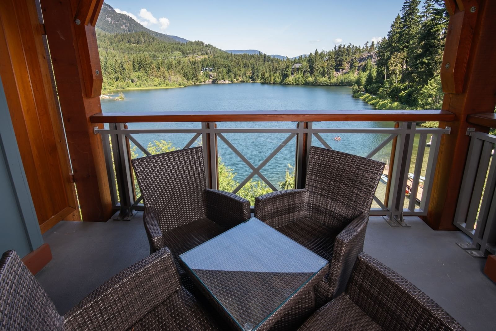 Nita Lake Lodge in Whistler, suite balcony on timber posts with a milled railing above the lake, built by Burj Enterprises